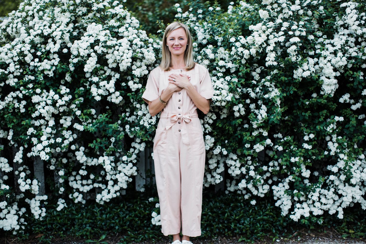 kellie-b1-i8 Kelli Mix standing in front of white flowers