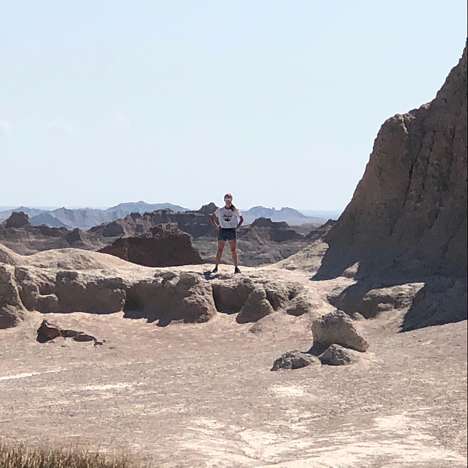 A woman standing on a rock