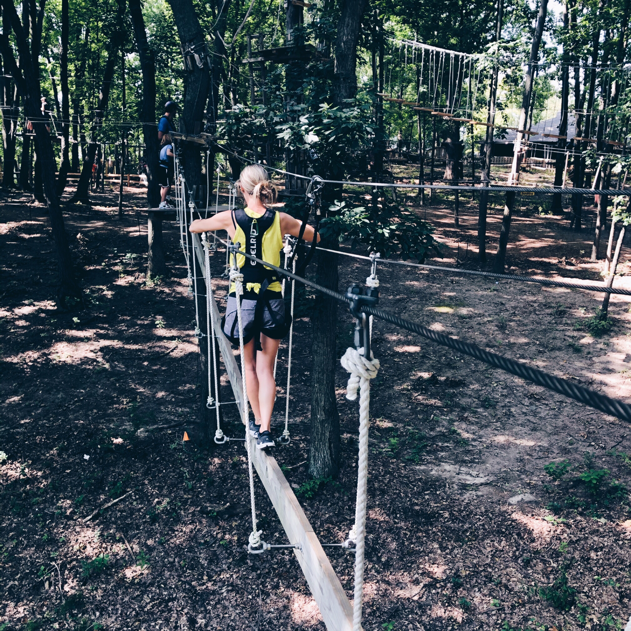 A woman walking on the hanging bridge